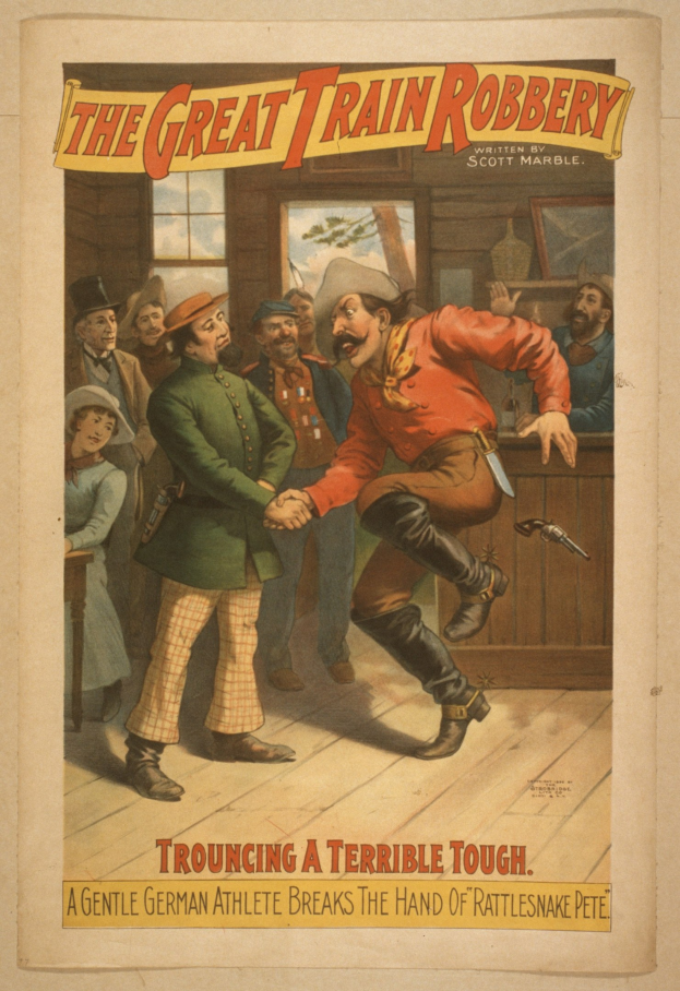 Plakat, das eine Gruppe von Menschen auf einem Boden zeigt, wobei einer eine Waffe hält, ein Fenster und eine Wand im Hintergrund und Text, der "Der große Zugüberfall - Trouching a Terrible Tough" an der Ober- und Unterseite liest.