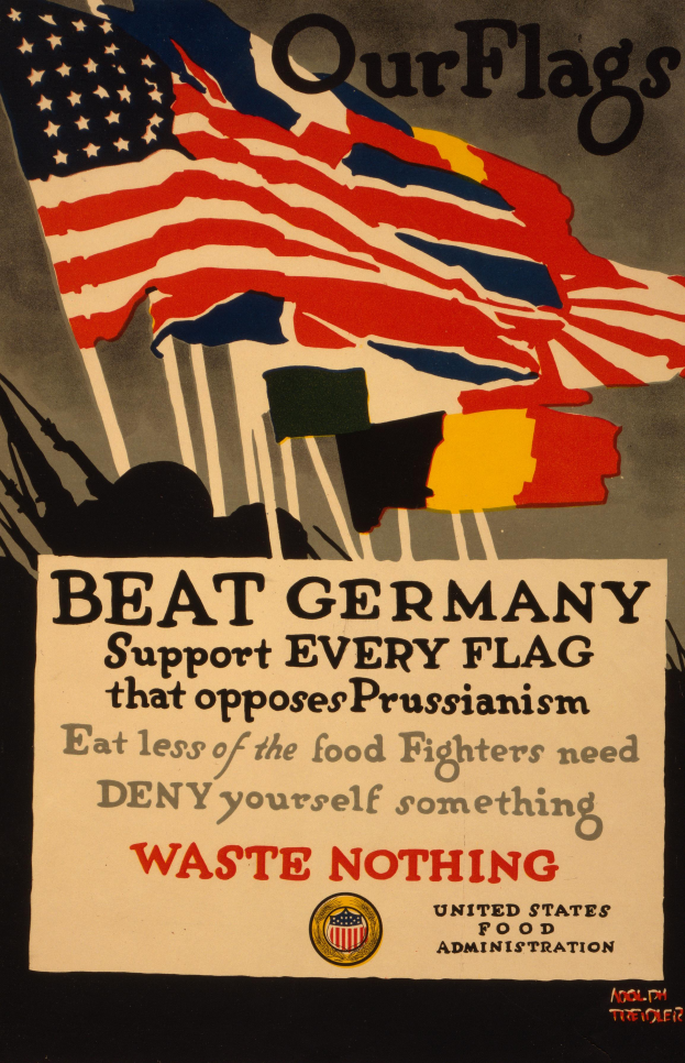 Ein Plakat mit einer roten, weißen und blauen Flagge mit einem weißen Stern und der schwarzen Schrift "Unsere Fahnen schlagen Deutschland - Unterstützt jede Fahne, die gegen Preußentum kämpft", mit einem weißen Rand um den Text.